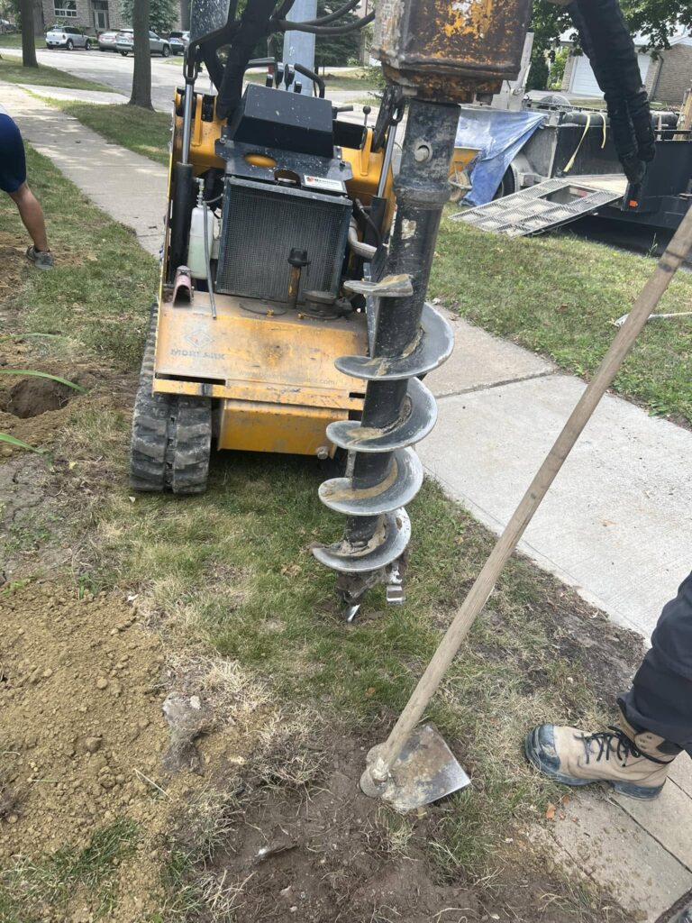 Compact auger machine used for pile and footing installation