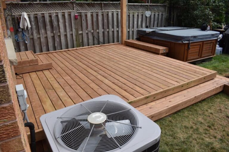 Backyard deck built around an AC unit