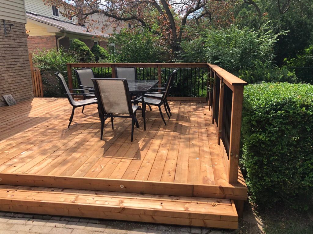 Custom cedar deck with dining area in a Toronto backyard