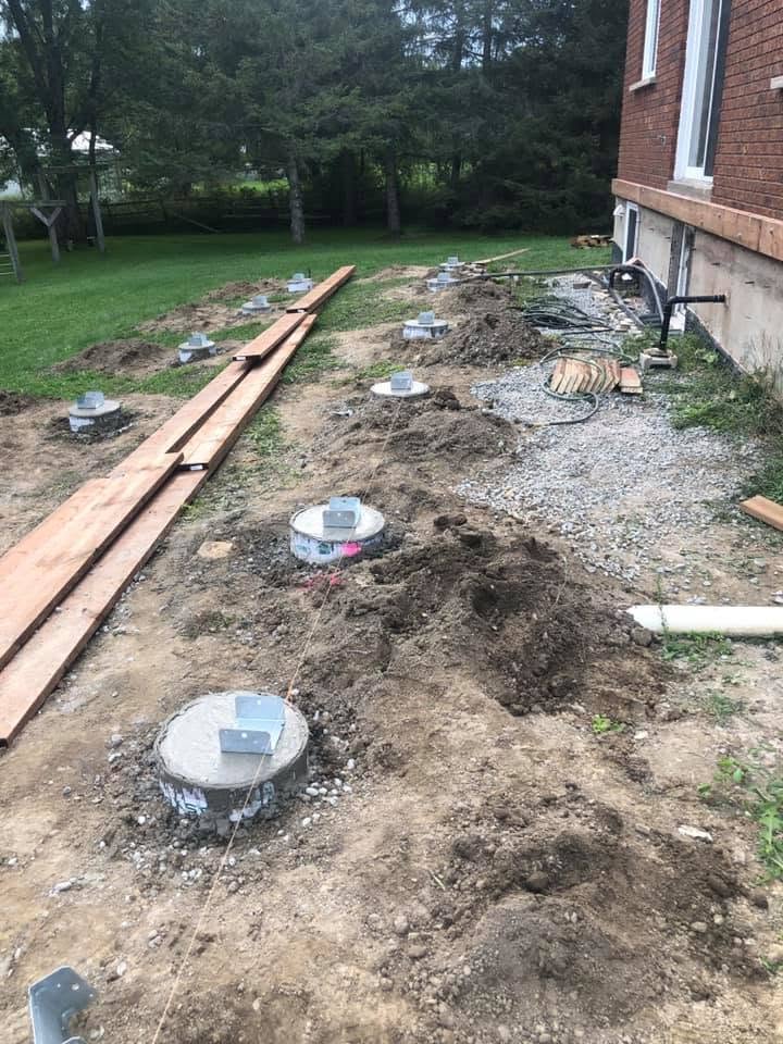 Helical piles installed for a backyard deck foundation in Toronto