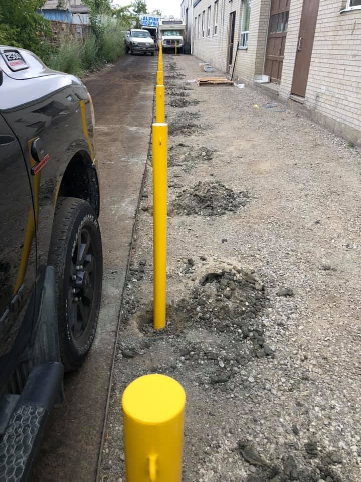 Newly installed bollard with concrete base, close-up