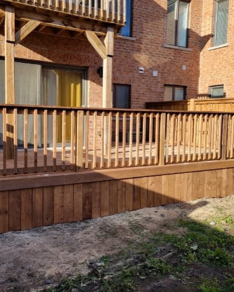 Raised wood deck with railings